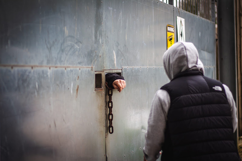 Activist speaking with security at slaughterhouse