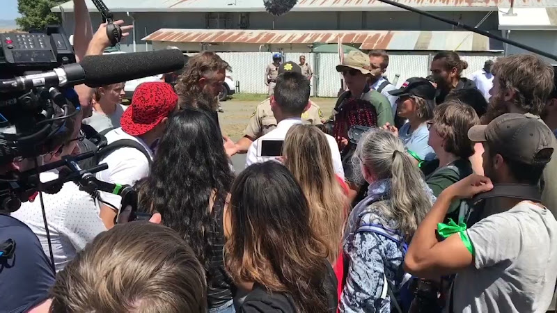 Wayne Hsiung Talks To The Police Outside Of Egg Farm