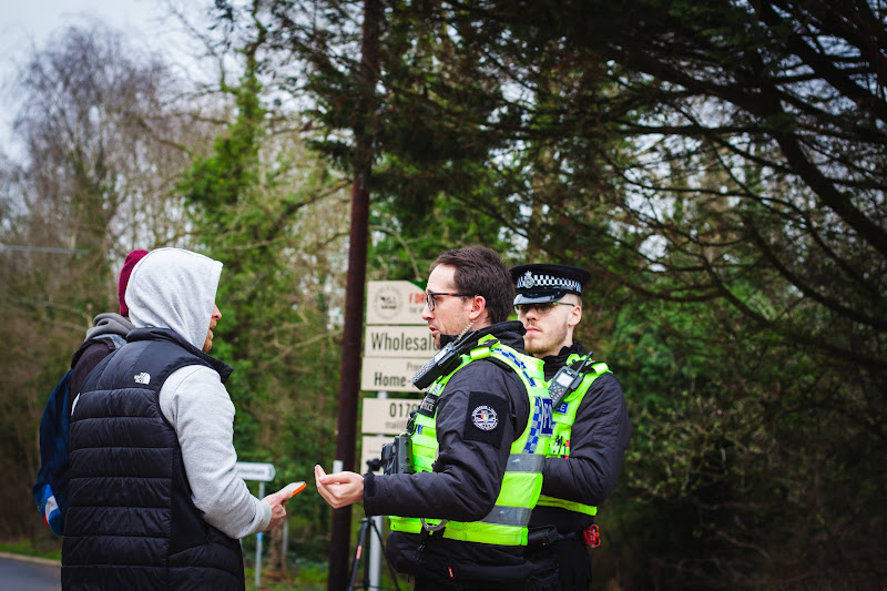 Activists speaking with police at slaughterhouse