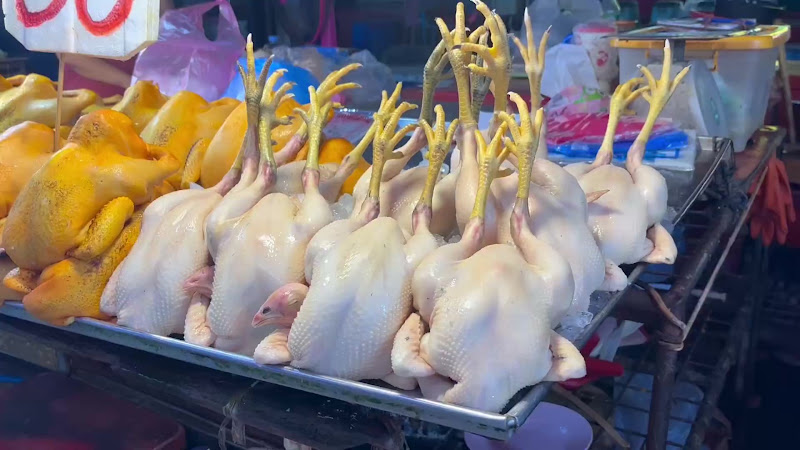 Plucked chicken for sale at food market