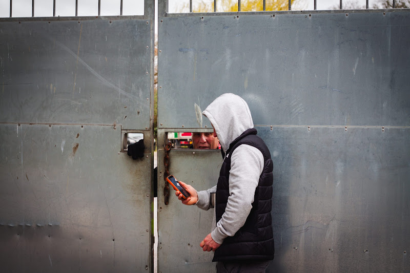 Activist speaking with security at slaughterhouse